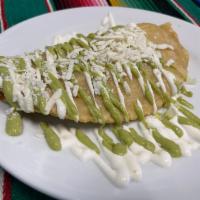 Fried Quesadilla · Fresh handmade corn tortilla stuffed with monterey jack cheese topped with avocado, sour cre...