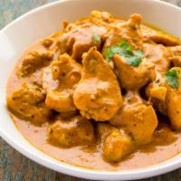 Murgh Makhani (Butter Chicken) · Delicious chicken tandoored in clay oven and cooked in butter, yogurt and tomato gravy.