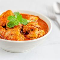 Chicken Curry · Chicken mixed with tasteful Indian spices and cooked with homemade special curry sauce. Serv...