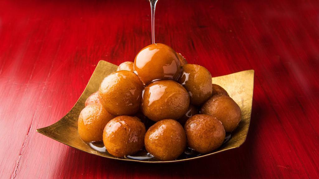 Gulab Jamun · Sweet ball of deep-fried paneer boiled in a sugar syrup.