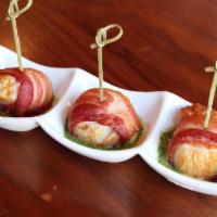 Bacon Wrapped Scallop · Tender sea scallop lightly wrapped in smoked bacon W/ 3 flavors cream sauce