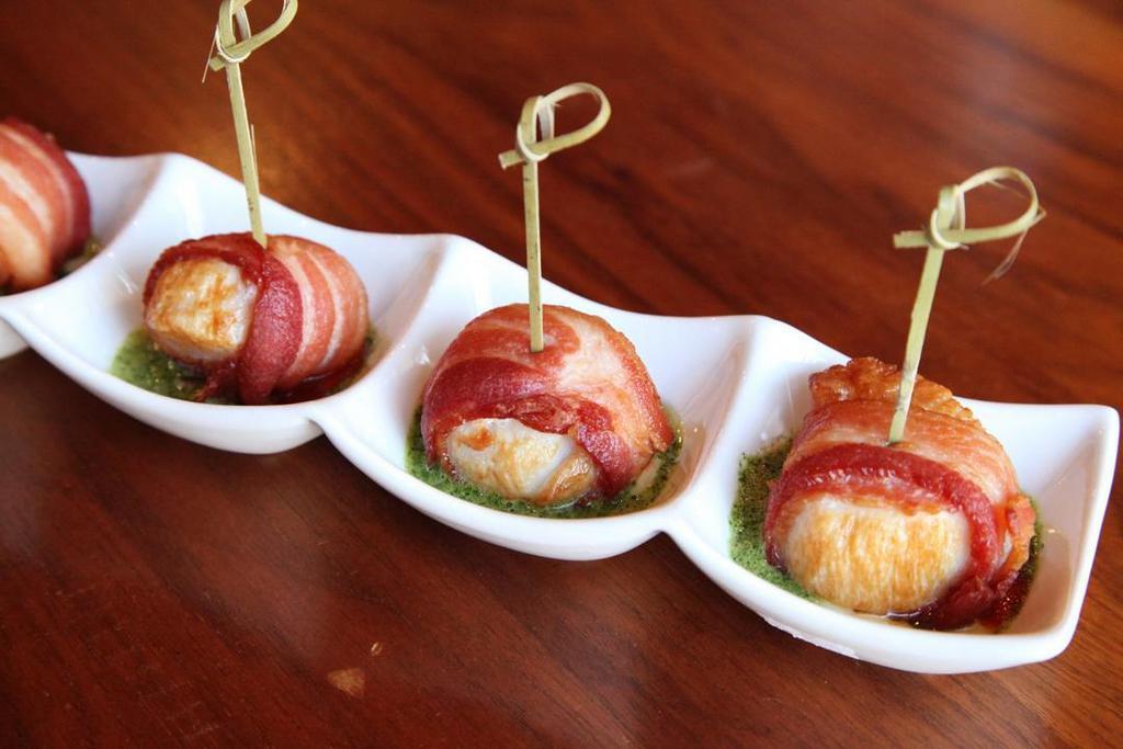 Bacon Wrapped Scallop · Tender sea scallop lightly wrapped in smoked bacon W/ 3 flavors cream sauce