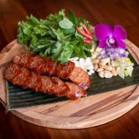 LAO Sausage · Laotian style pork sausage + fresh ginger + toasted peanut W/ bird’s eye chili