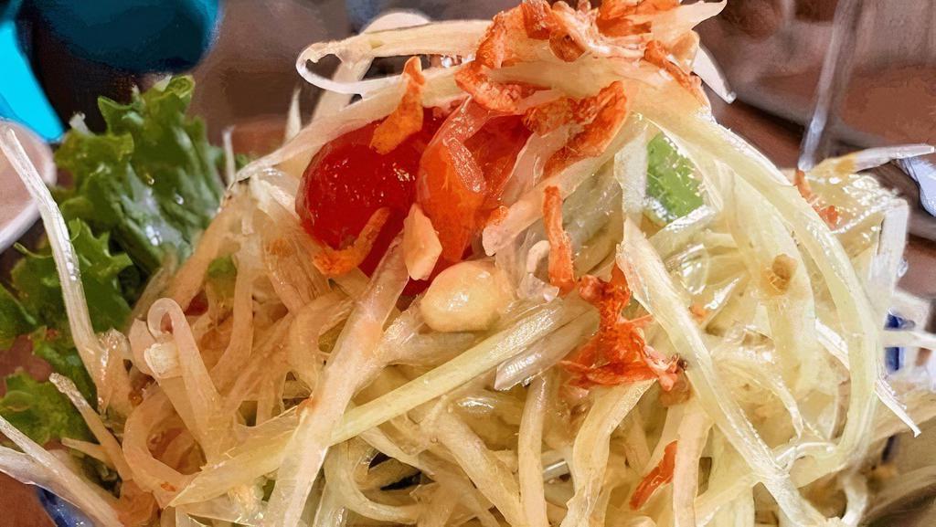 Thai Papaya Salad · Papaya salad + dried shrimp + Thai chili + tomato + peanut + tamarind lime dressing