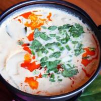 Tom Kha · Traditional coconut soup W/ lemongrass + galangal + Kaffir lime + mushroom