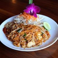 Pad Thai · Rice noodles wok-fried + egg + bean sprouts + chives in tamarind reduction + served W/ peanu...