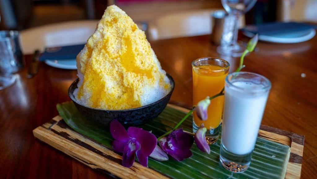Mango Tango Shaved Ice · Mango and sticky rice , mango puree, cream of coconut with mango shave ice.