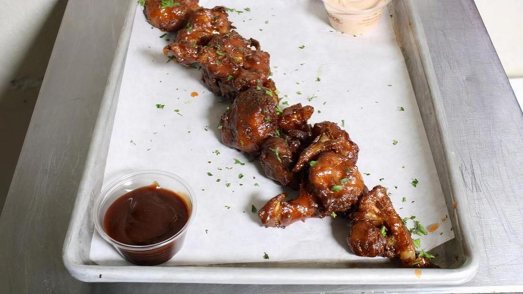 Vegan Cauliflower Wings · Cauliflower bites coated in GF batter, deep fried, & coated in spicy adobo sauce; w/ dipping sauce.  Serving suggestion: order w/sauce on the side; coat w/ sauce after reheating.