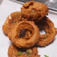 Onion Rings · Crispy onion rings, coated in GF batter and deep fried.