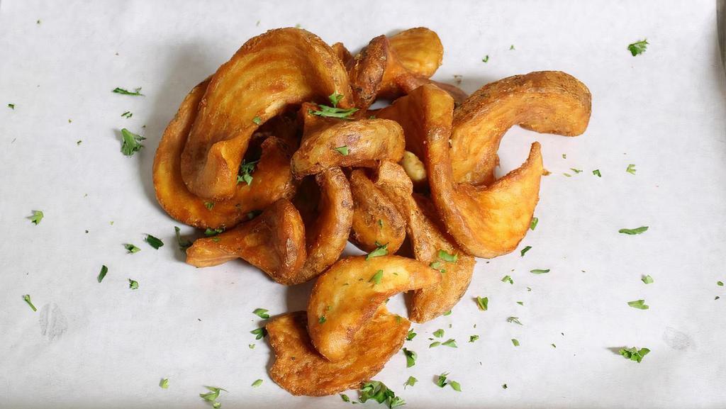 Regular Fries · Our signature curly wedges of potatoes fried to a crispy golden brown.