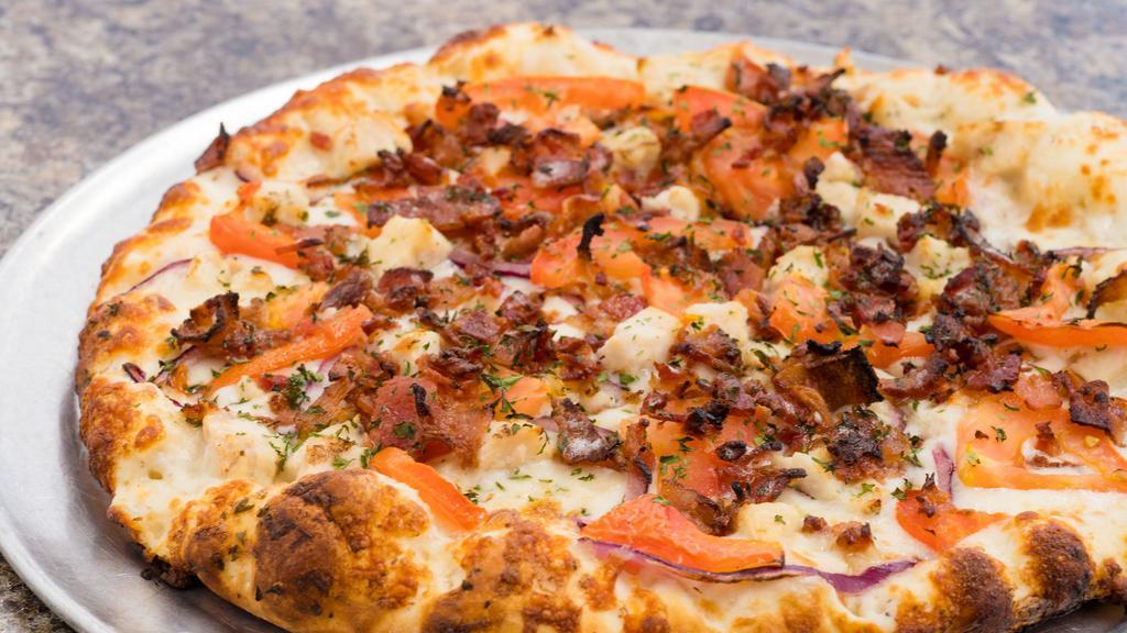 Chicken Bacon Ranch Large · Simply heavenly with grilled chicken breast, smoky bacon, red onions, fresh California tomatoes and six naturally aged California cheeses on top of a flavorful ranch sauce.