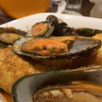 Mussels · 1 lb of mussel in savory and garlicky sauce.