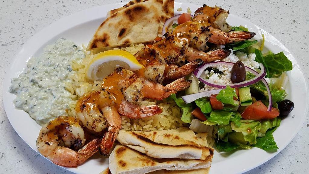 Wild Shrimp Souvlaki Plate · wild shrimp grilled to perfection, marinated with garlic and rosemary.
