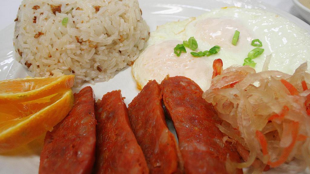 Longanisa SILOG · Pork sausage served with choice of garlic or steamed rice topped with fried eggs and a side of veggies.