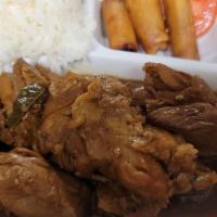 Chicken Adobo over Rice · Boneless chicken meat in soy-vinegar marinade served with steamed rice and spring rolls.
