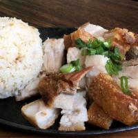 Lechon Kawali over Rice · Crispy pork cutlets called kettle pork, served with steamed rice and spring rolls.