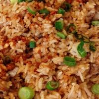 Adobo Rice · Rice bowl flavored with adobo meat sauce. Choice of chicken or pork topping. Serves 2-3 peop...