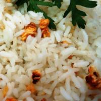Garlic Rice · Jasmine rice cooked in garlic and topped with green onions. Choice of single cup or bowl for...