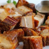 Lechon Kawali · Kettle pork. Belly cutlets deep-fried to golden crisp. Comes with liver dipping sauce. Serve...