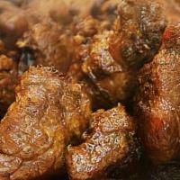 Pork Adobo · All-meat pork cutlets in soy-vinegar sauce cooked in bay leaves, pepper, onions and garlic. ...
