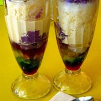 Halo-halo · Asian fruit mix in crushed ice and milk topped with taro ice cream. Served in a 16oz clear c...