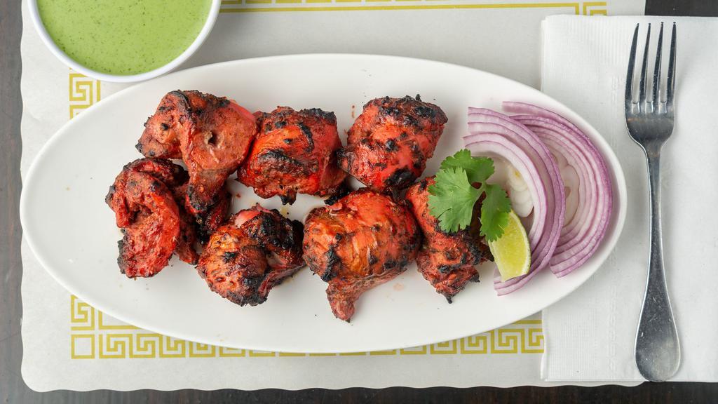 Jali Chicken Tikka · Tender chicken breast marinated with special spices cooked on griddle.