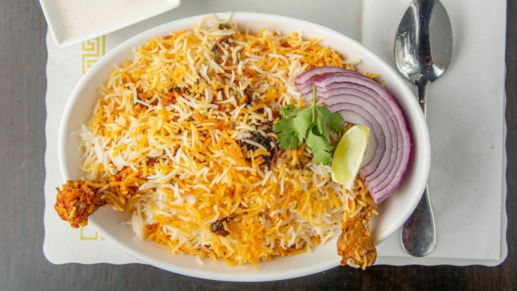 Chicken Dum Biryani · Marinated chicken cooked with rice and spices.