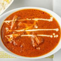 Butter Chicken · Boneless barbequed chicken cooked in tomato sauce and finished with fresh cream and butter.