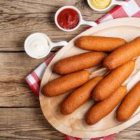 Corn Dogs · Delicious hot dog surrounded in sweet corn batter.