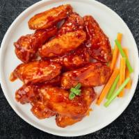 Hot Wings  · Fresh chicken wings breaded, fried until golden brown, and tossed in hot sauce. Served with ...