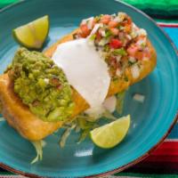 Chimichanga · Crispy flour tortilla rolled and filled with rice, whole beans, and cheese, topped with guac...