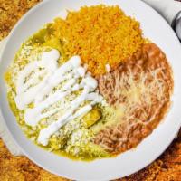 Enchiladas Verdes · Two tortillas rolled and filled with chicken, covered with our green sauce, cheese, onions, ...