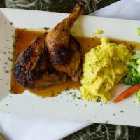 Pomegranate Chicken · Infused with pomegranate sauce and served with roasted garlic mashed potatoes and vegetables.