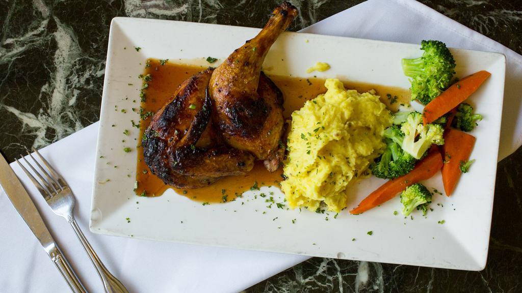 Pomegranate Chicken · Infused with pomegranate sauce and served with roasted garlic mashed potatoes and vegetables.