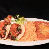 Sneakers Street Tacos · Marinated steak, corn tortillas, roasted salsa cheese, onions, cilantro, Spanish rice, refri...