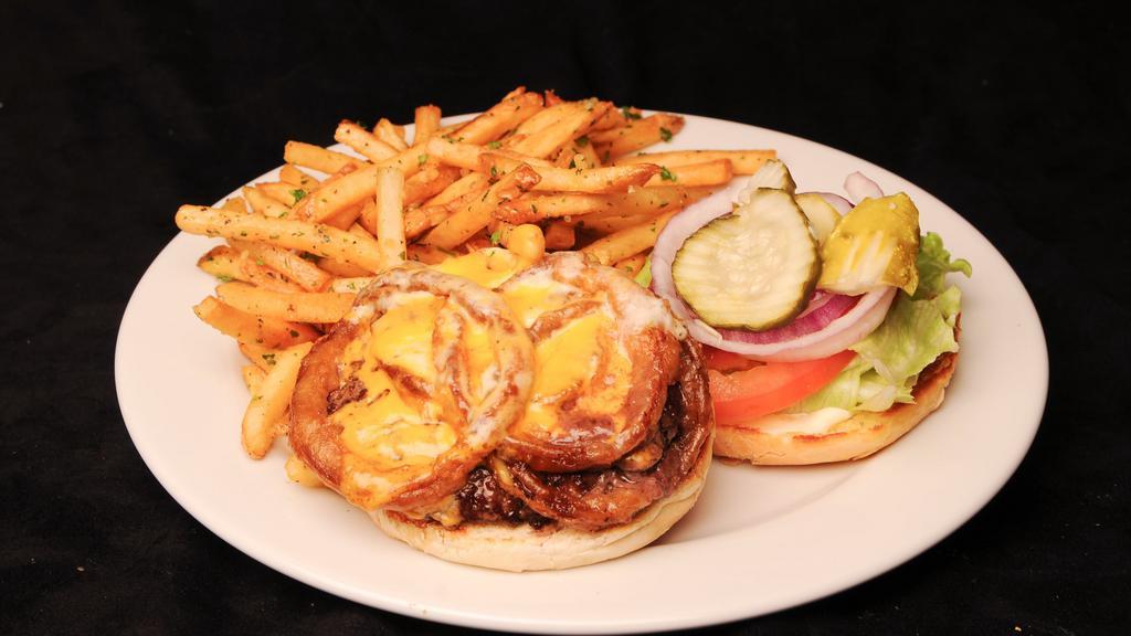 Peppercorn Burger · Pepper-crusted, jack, cheddar, onion rings, spread lettuce , tomato, pickles, onions, side dish.