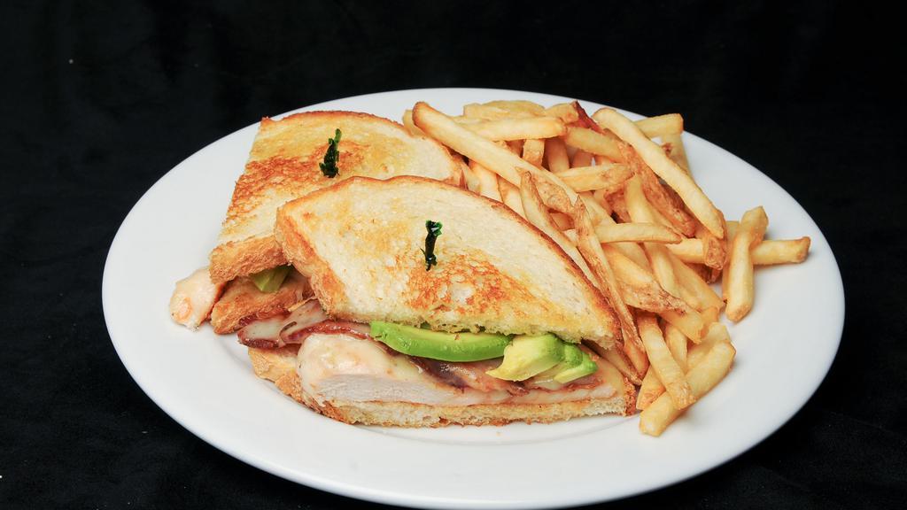 Grilled Chicken Club Sandwich · Bacon, avocado, swiss, grilled sourdough, side dish.