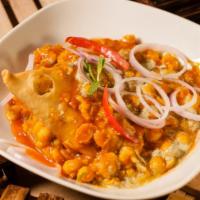 Samosa Chat · Features a delicious samosa chaat served with a side of fresh garbanzo mint masala yogurt an...