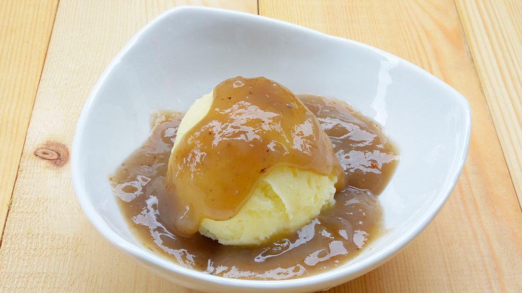 Mashed Potatoes & Gravy · Creamy & Buttery mashed potatoes, topped with brown gravy.