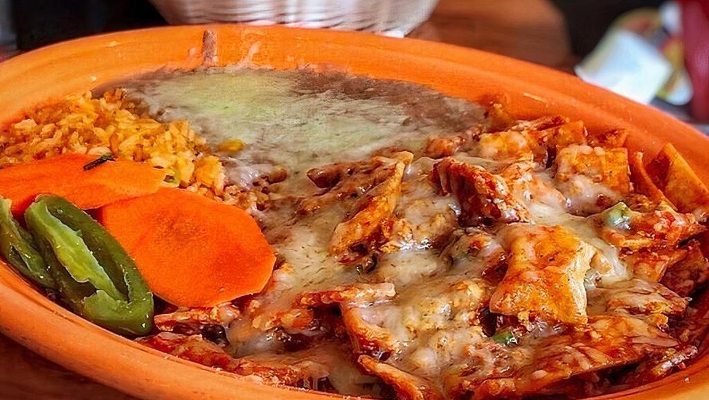CHILAQUILES ROJOS O VERDES · TWO LARGE EGGS SCRAMBLED WITH TORTILLAS TOPPED W/CHOICE OF RED OR GREEN SAUCE & CHEESE, RICE & BEANS.