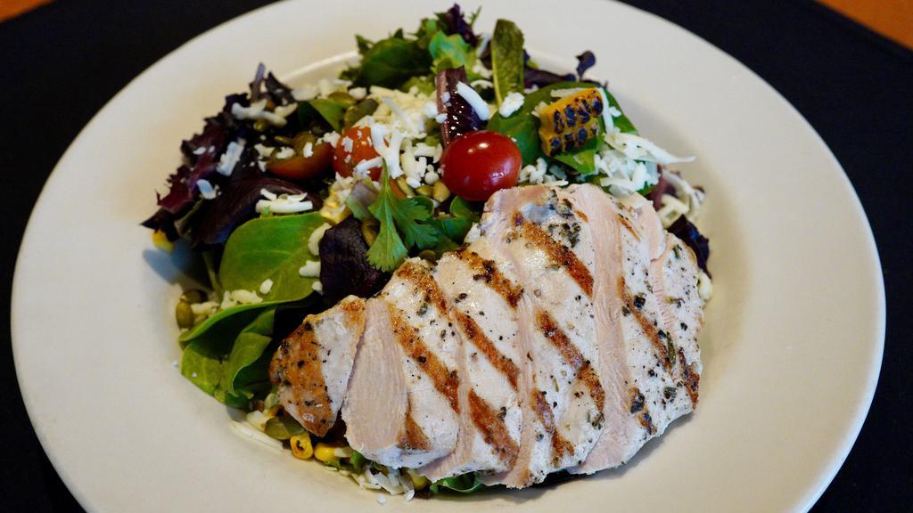 Cilantro Lime Chicken Salad · 490cals. organic baby greens, jack cheese, heirloom tomatoes, grilled corn, pumpkin seeds, cilantro lime vinaigrette
*Picture shown w/ protein added