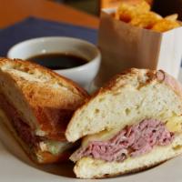 Prime French Dip* · 1150/1050cals. Warm roast beef, au jus, sharp white cheddar cheese, toasted parmesan baguette.
