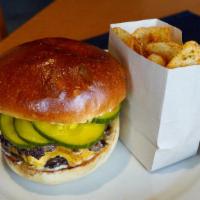 Nordstrom Double Beef Burger · 1320/1210 cal. American cheese, roasted garlic aioli, housemade b&b pickle