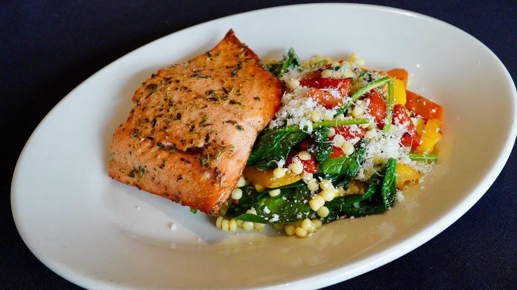 Wild Salmon W/ Roasted Vegetables & Saffron Couscous · 680cals. tuscan roasted salmon, peppers, carrots, baby spinach, parmesan cheese, creamy garlic vinaigrette