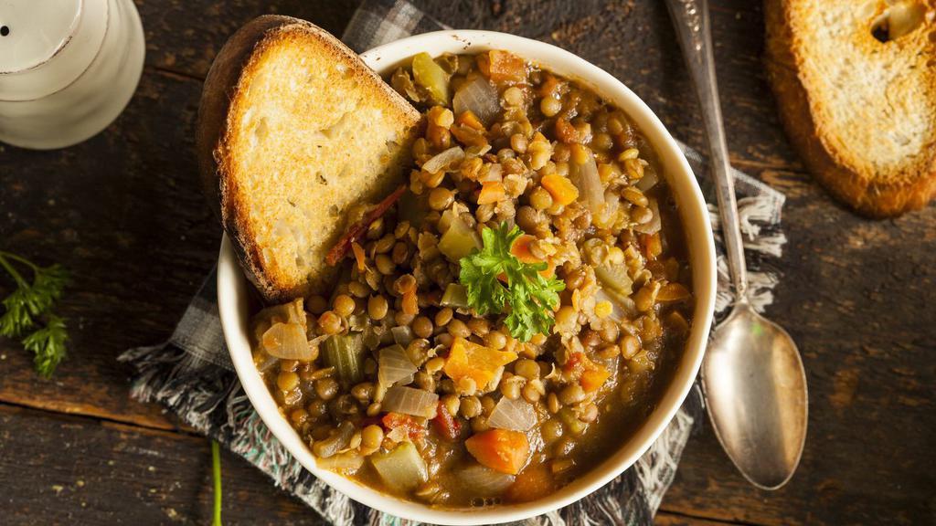 Lentil Soup With Bread · Fresh lentil soup made with red lentils, tomatoes, pepper paste and mint. Served with warm housemade bread.
