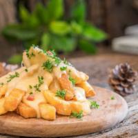 Cheese French Fries · Melted cheese topped on fresh hand cut potatoes.