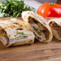 Lamb & Beef Gyro Wrap · Thin sliced lamb and beef, fresh whipped hummus, lettuce, sliced tomatoes, cucumbers, bell p...