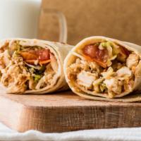 Chicken Shawarma Wrap · Flavorful chicken shawarma, hummus, lettuce, sliced tomatoes, cucumber, bell peppers, onions...