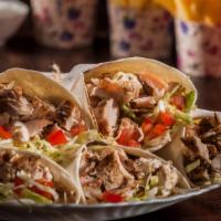 Combo Kebab Wrap · Thin sliced beef & lamb meat, chicken kebab, diced tomatoes, lettuce, onions, red cabbage, a...