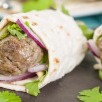 Kofte Wrap · Fresh ground beef & lamb, whipped hummus, lettuce, tomatoes, cucumbers, bell peppers, onions...